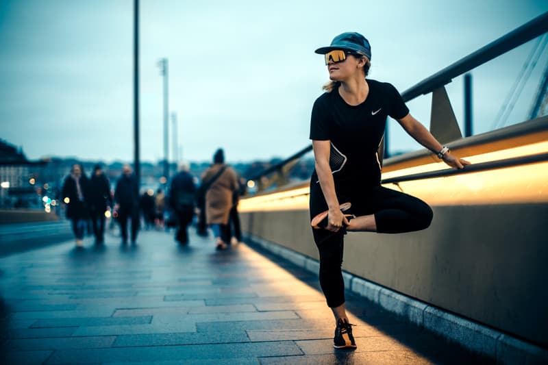 Girl running at the bridge connecting the Old Town and Södermalm in Stockholm