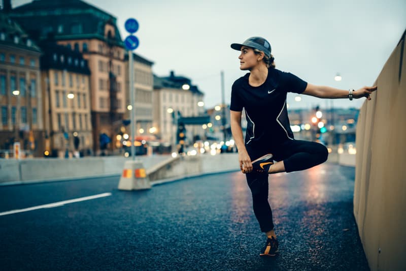 Girl running on the bridge between the Old Town and Södermalm in Stockholm