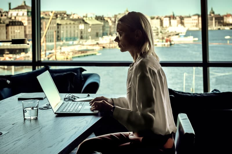 Working in Stockholm Woman working in Stockholm with panoramic view over the Old Town and the city